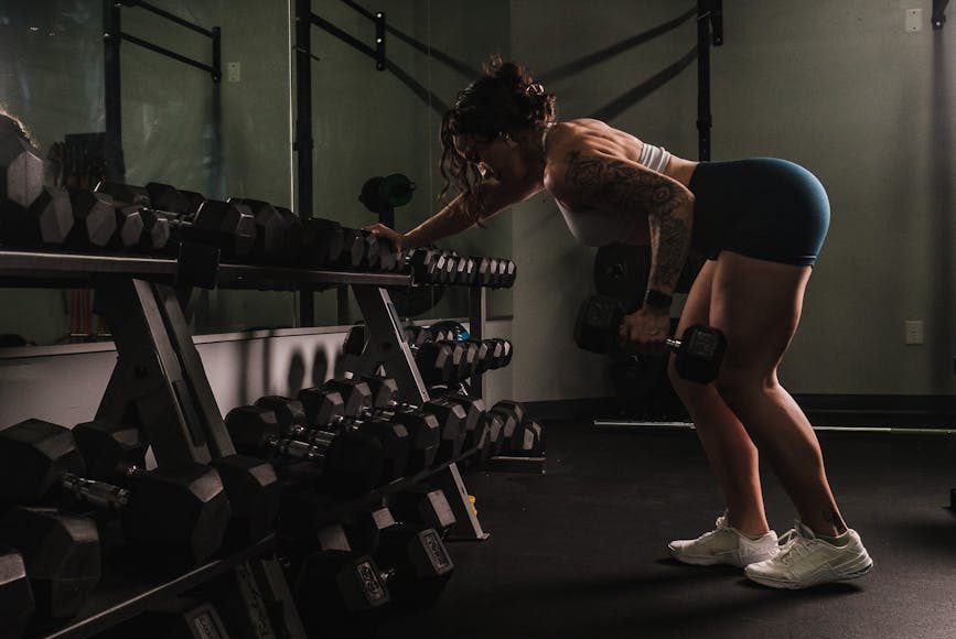woman lifting weights in a gym