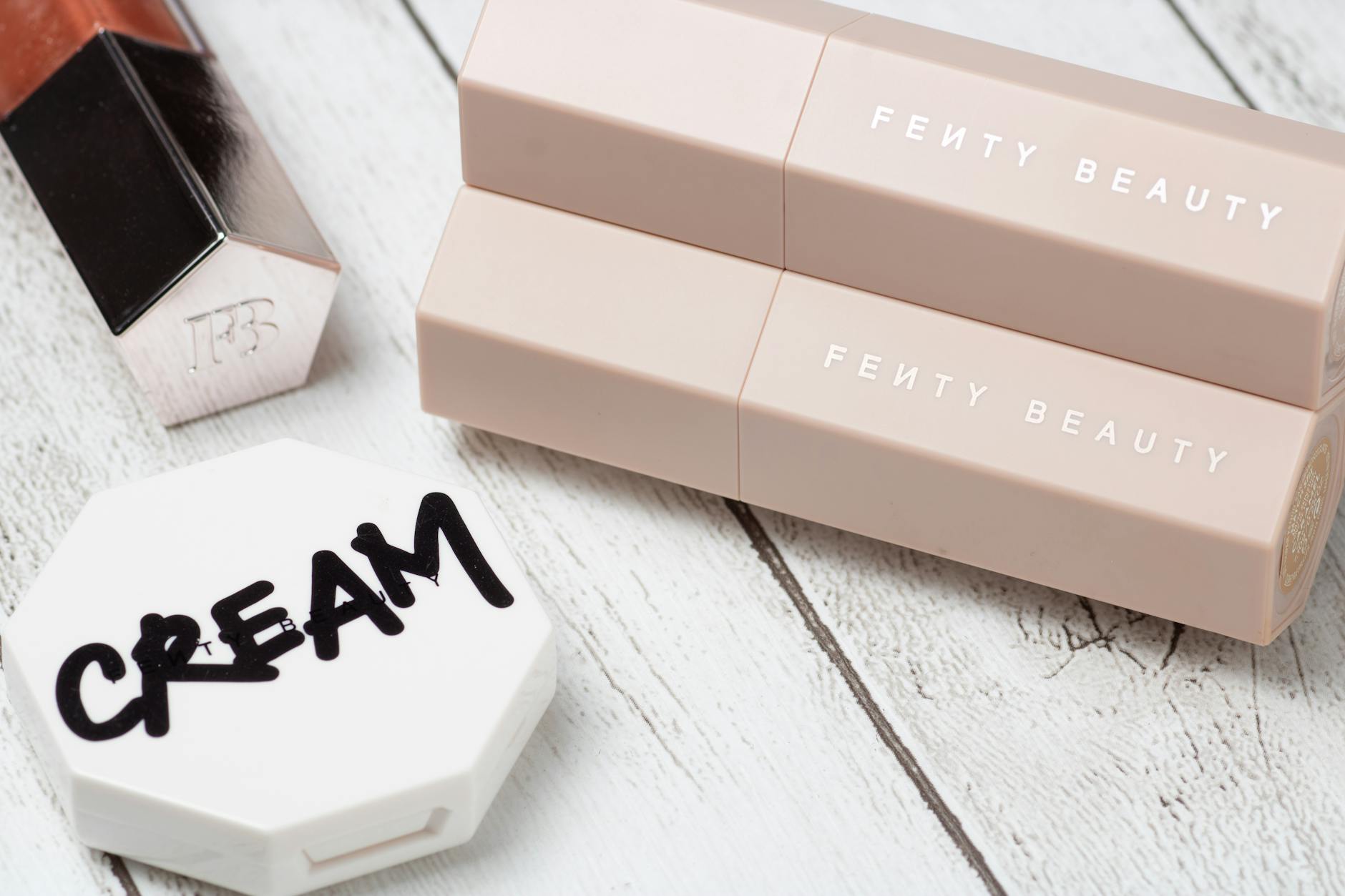 cosmetic products over wooden table