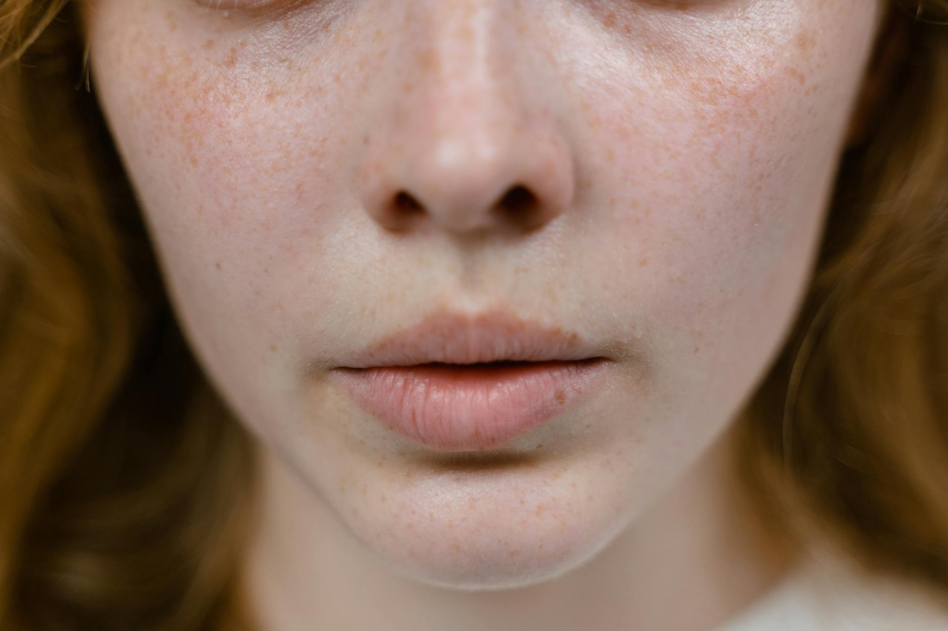 face of woman in close up photography