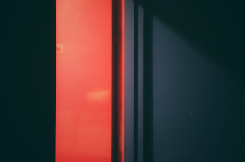 an open red flush door