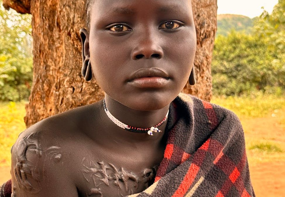 portrait of a mursi woman in rural ethiopia
