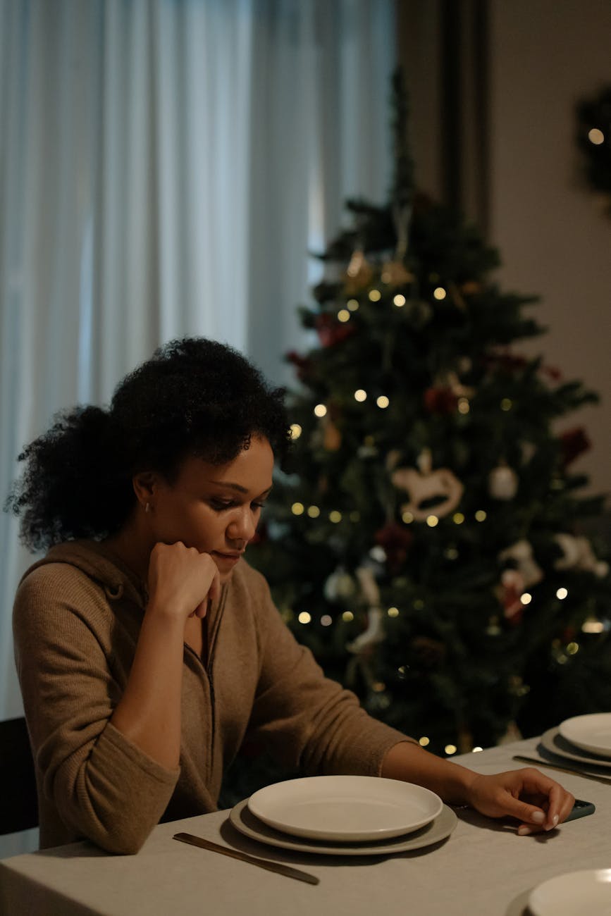 woman sitting beside a tables